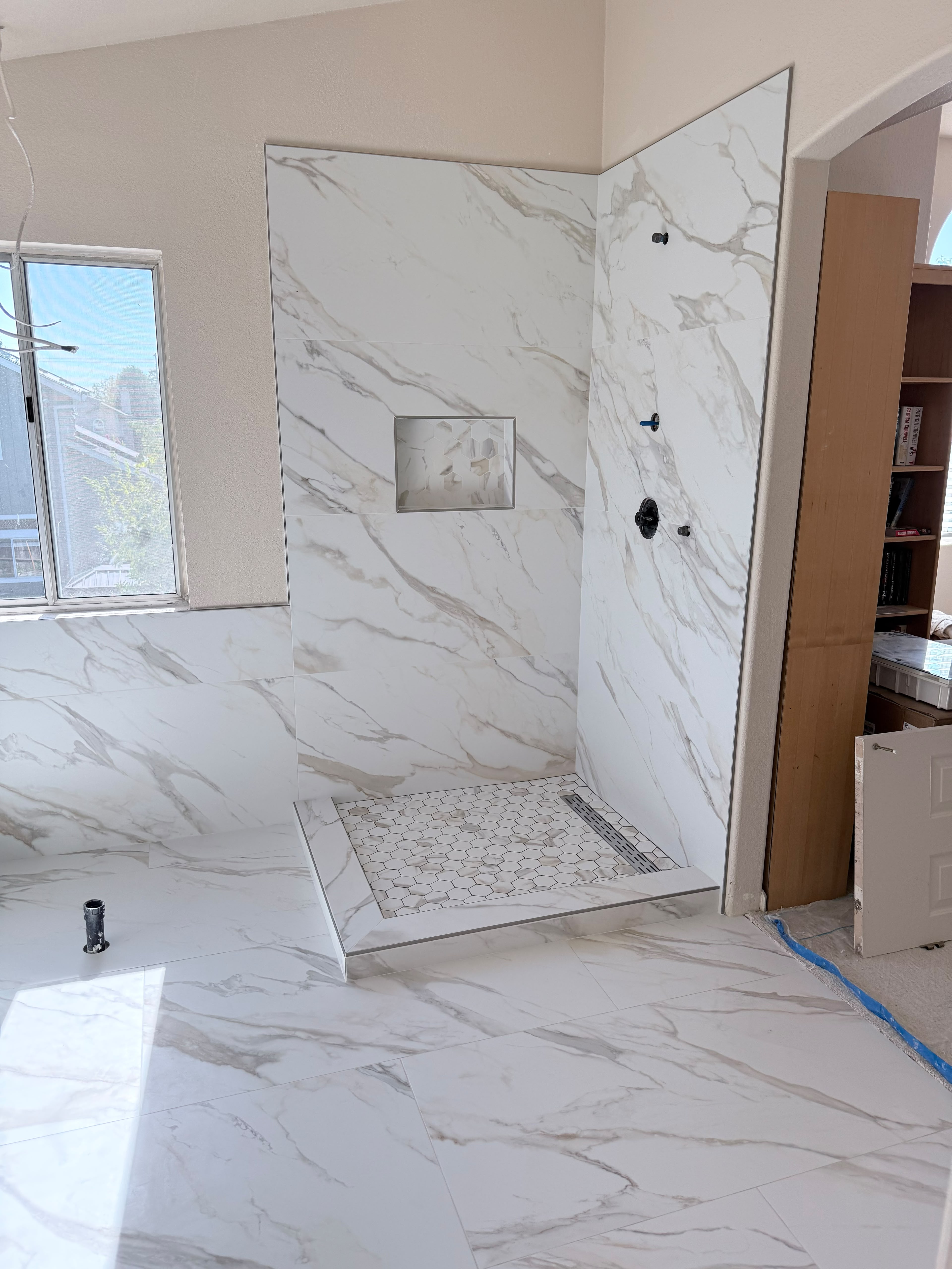 Custom marble-look shower tilework
